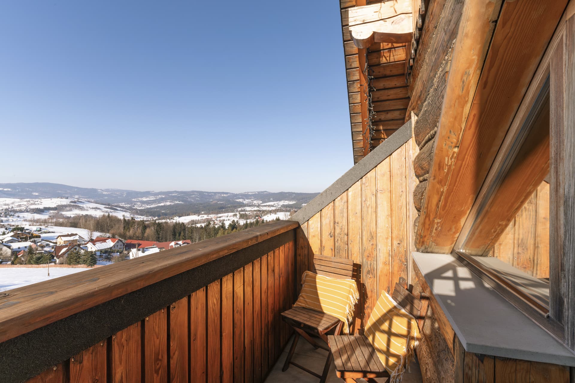 Balcony of room 7 with outdoor seating over the snowy Beskid mountains