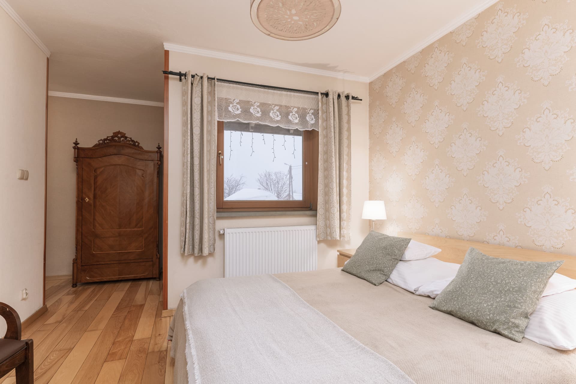 Double bed and antique wardrobe in Budget Double Room