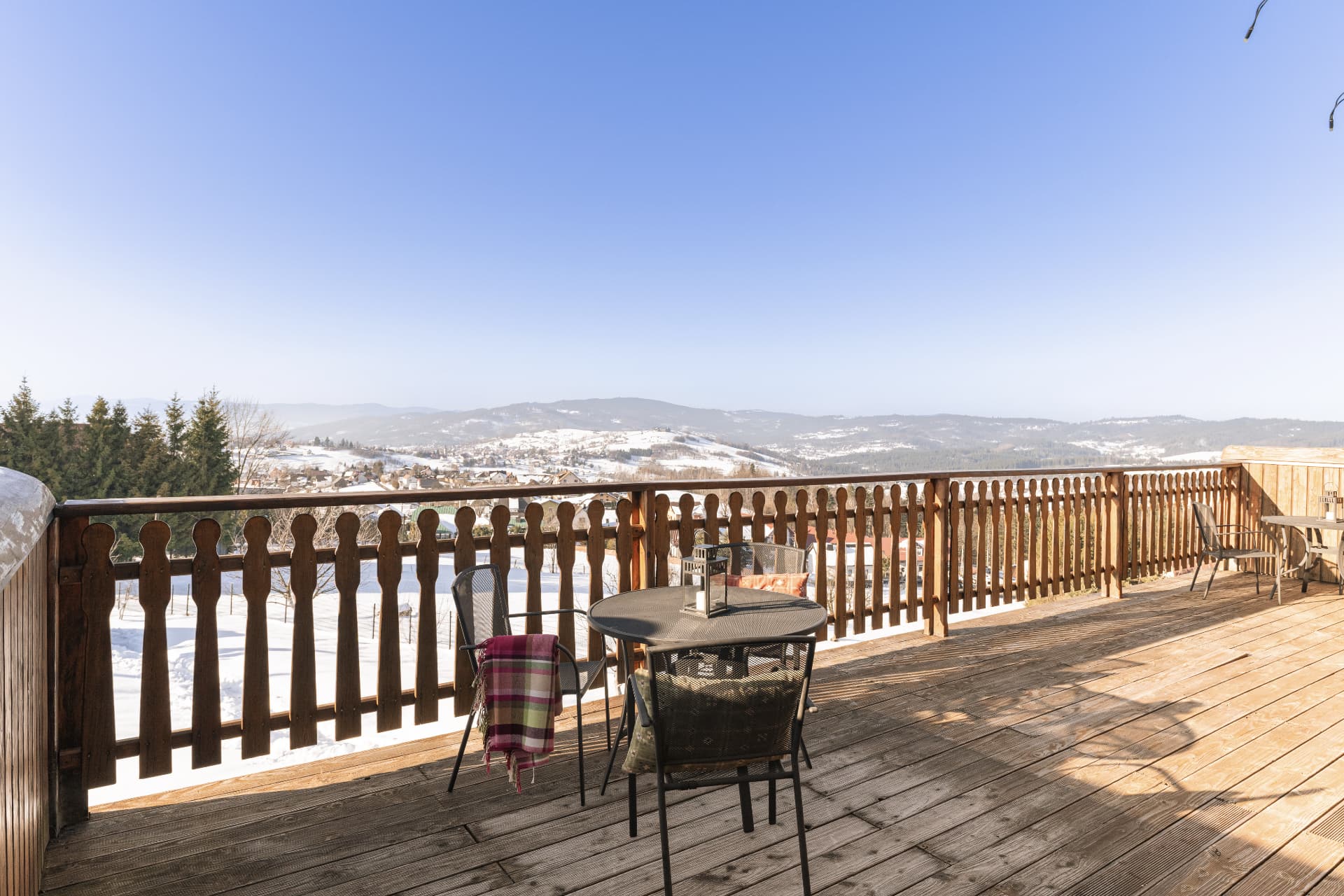 Balcony of Deluxe Double Room overlooking the snowy Beskid mountains