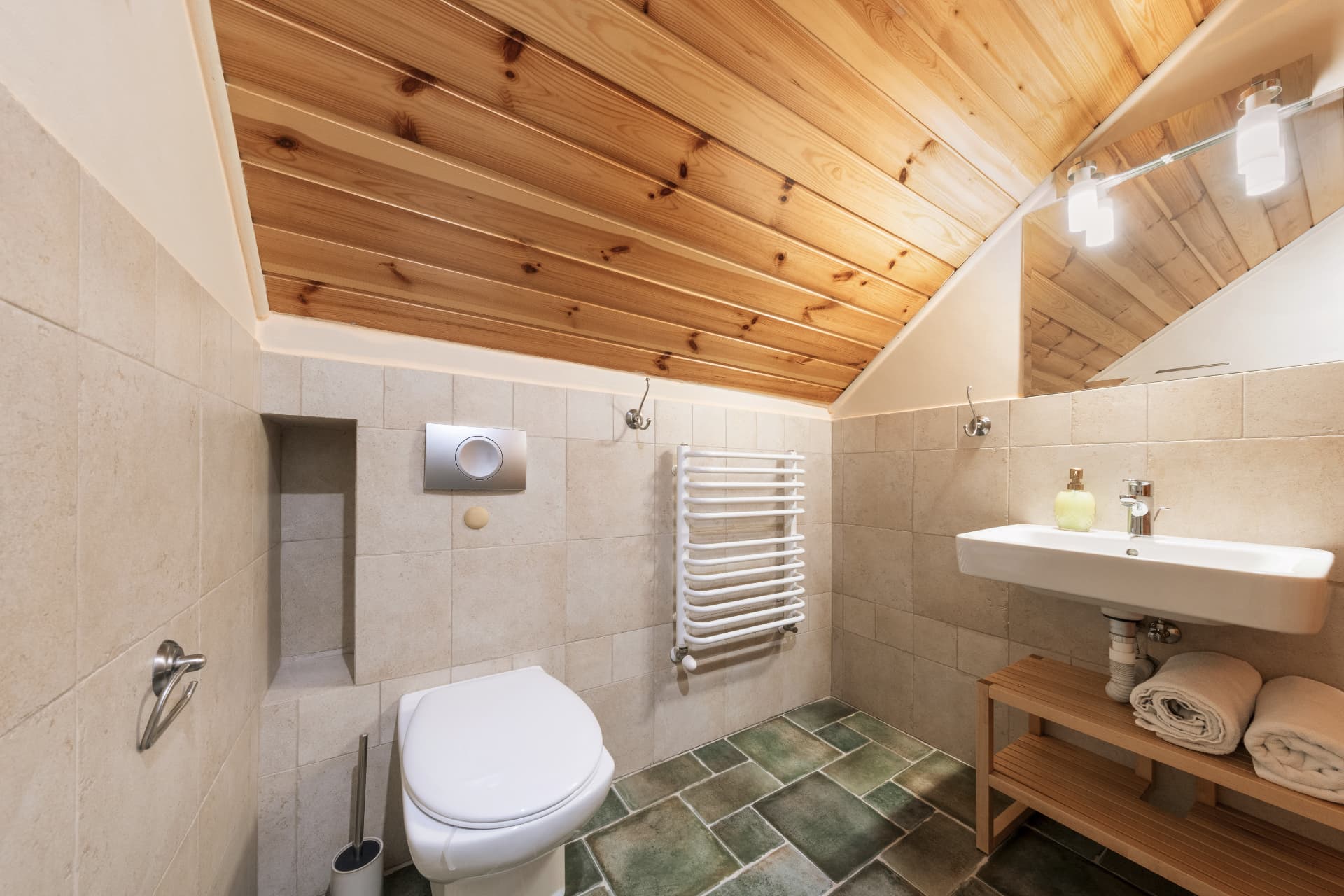 Bathroom of room 8 with a toilet, sink and towel radiator